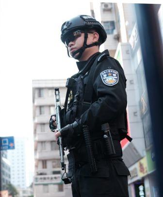 Unsplash Armed Policeman picture.
